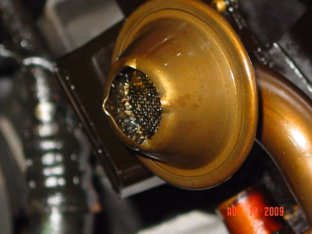 How to remove engine oil sludge?