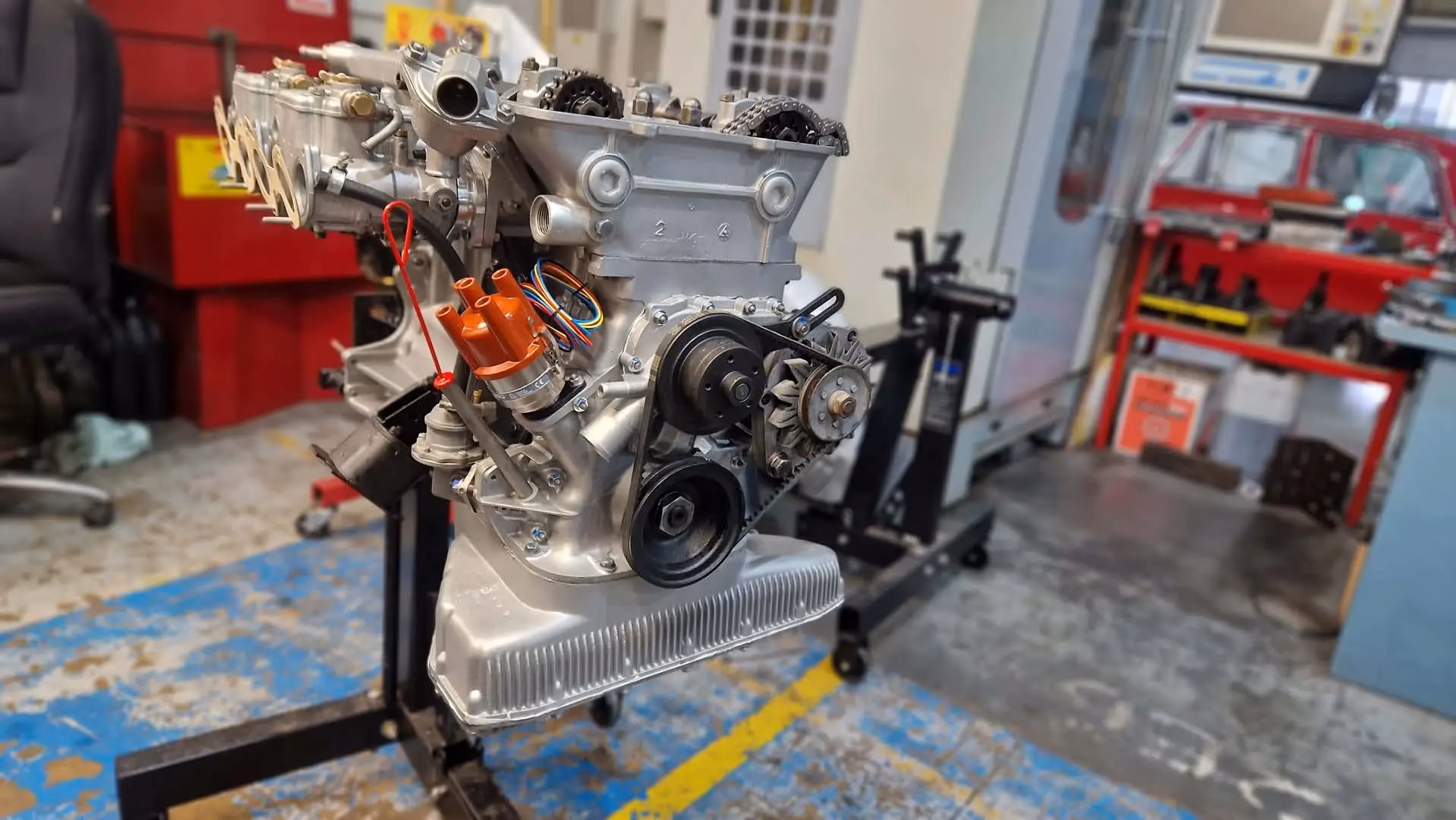When did AC motors start importing American V8 engines?