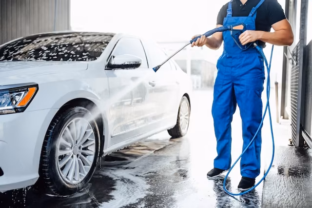 How do you clean a car with a pressure washer?