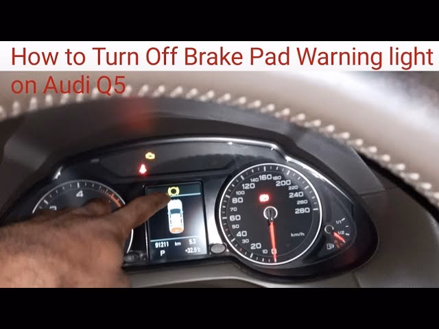 Why is my Audi Q5 brake pad warning light on?