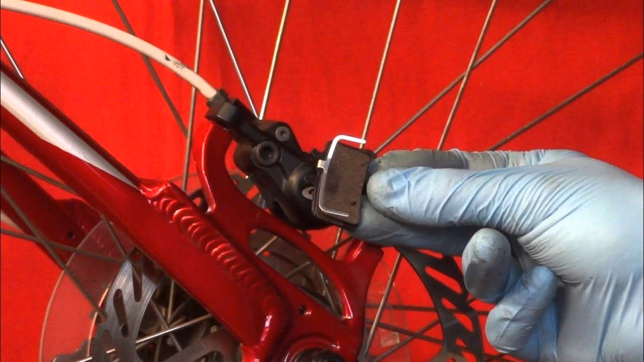 How do you remove caliper pads?