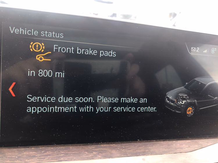 When should you replace brake pads on a BMW?