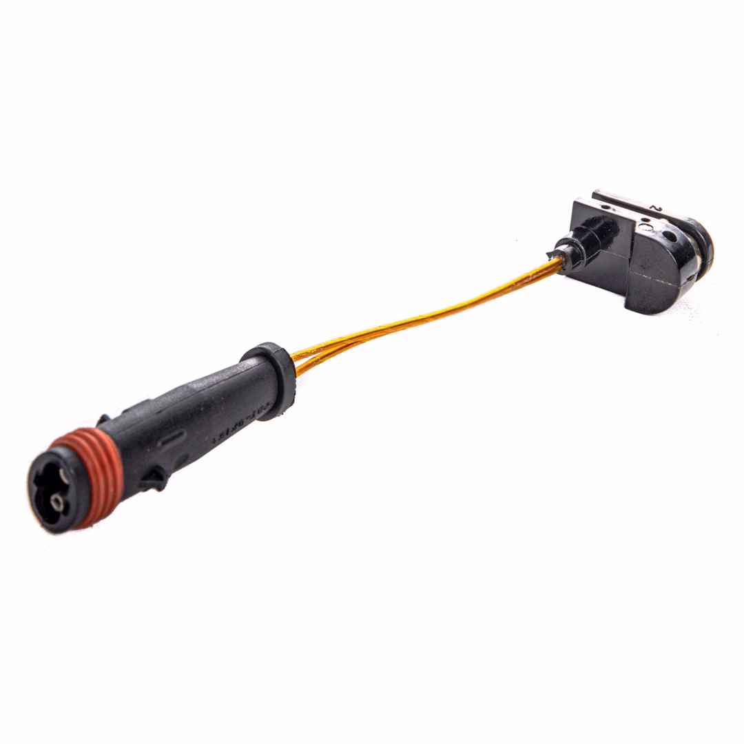 How does a brake pad wear sensor function?