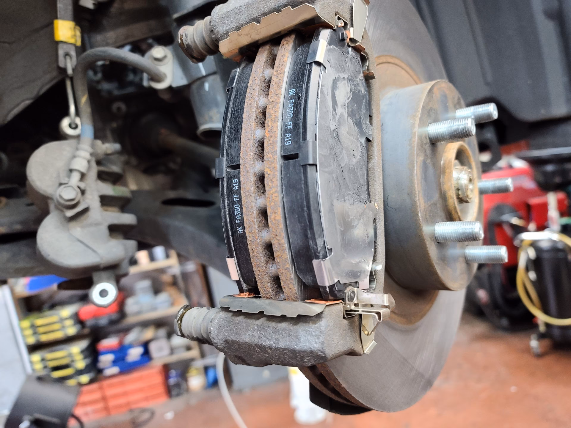How do you push a brake caliper back in?