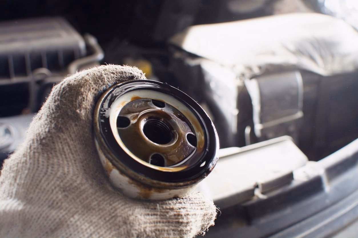 Can contaminated brake fluid cause brake fade?