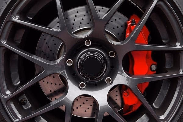 How do you check brake pads on a car?