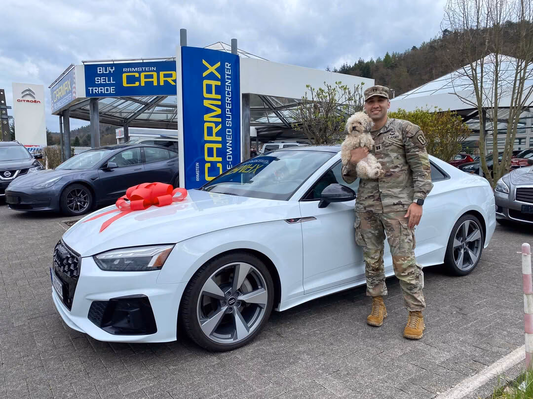 Can a military person buy a new car?