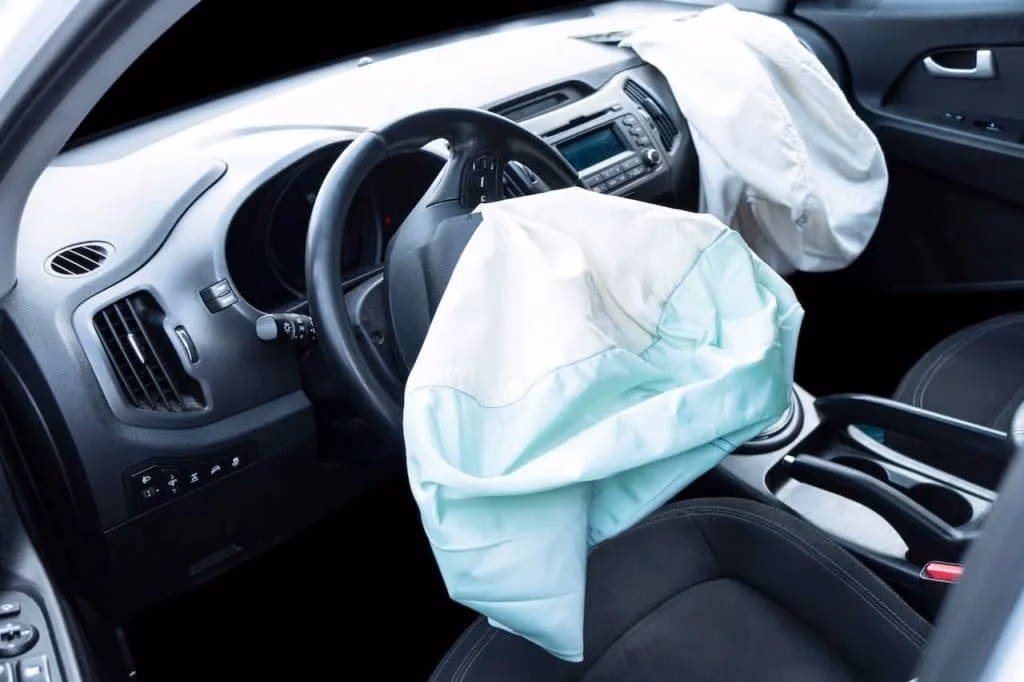 What happens when airbags deploy in a collision?