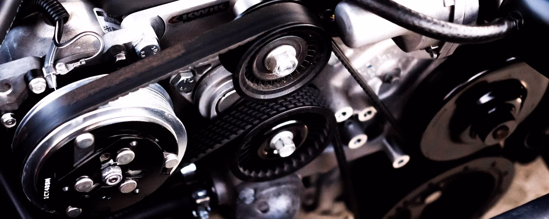 What is an auxiliary belt in a car?