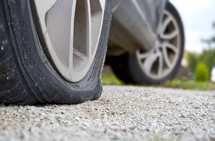 What causes a flat tire?