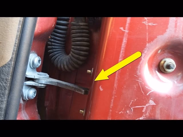 How do I remove the door check strap?