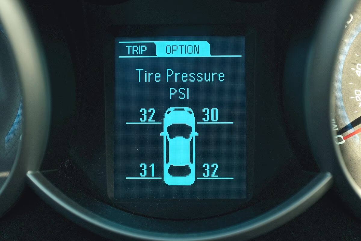 What causes a service tire monitor system message?