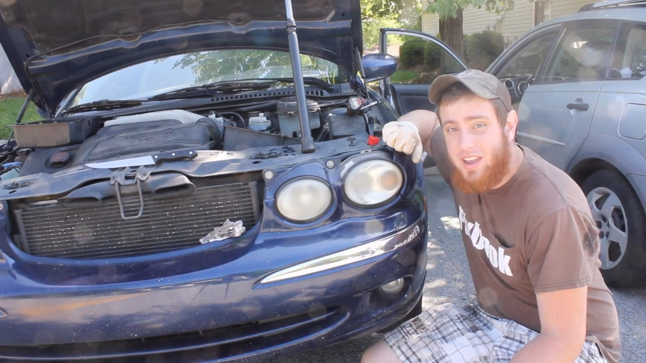 How do I change the transmission fluid level on a Jaguar?