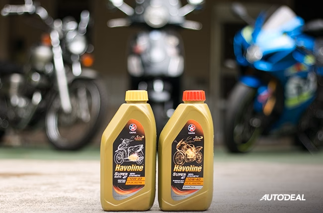 How do you change engine oil on a scooter?