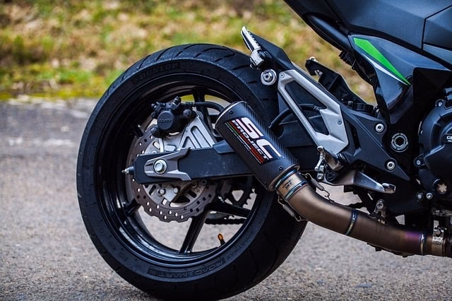 What happens if you change the exhaust system on a motorcycle?