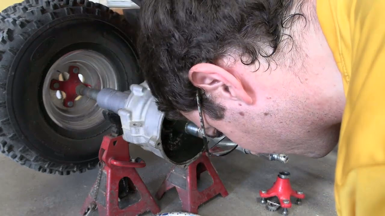 How do I change the oil on my trx300fw?