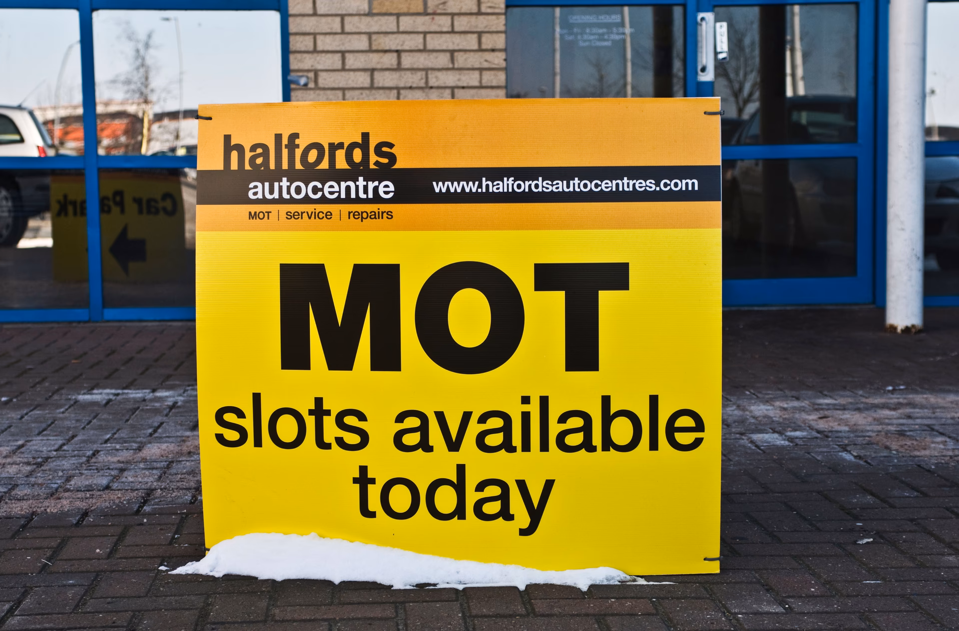 How can Halfords Autocentres help employees save money?