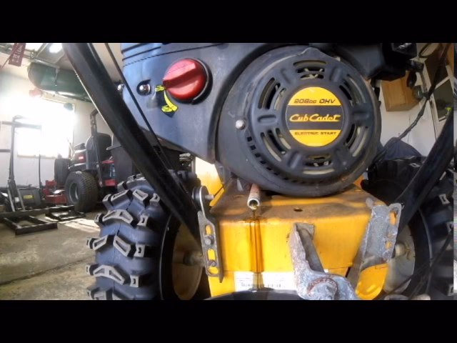 How do you change the oil in a snow blower?