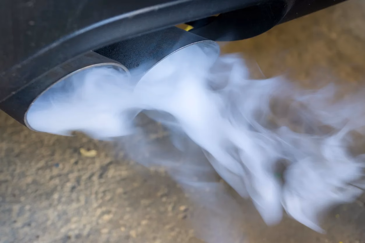 Can fuel injectors cause white smoke from diesel engine exhaust?