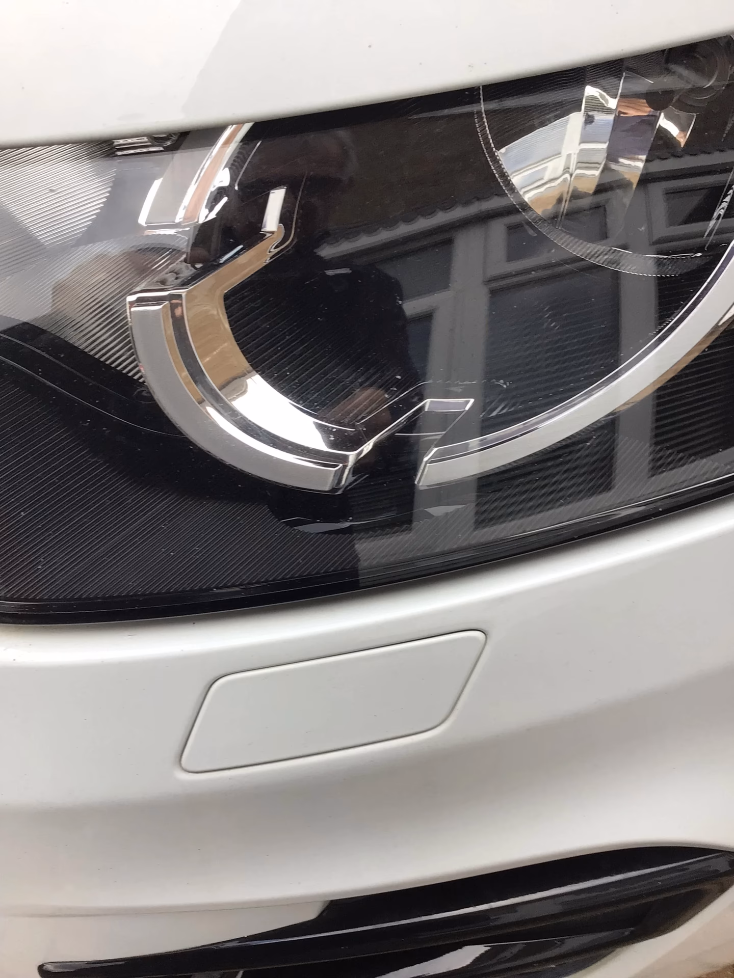 Do I need a headlamp washer if I have xenon?