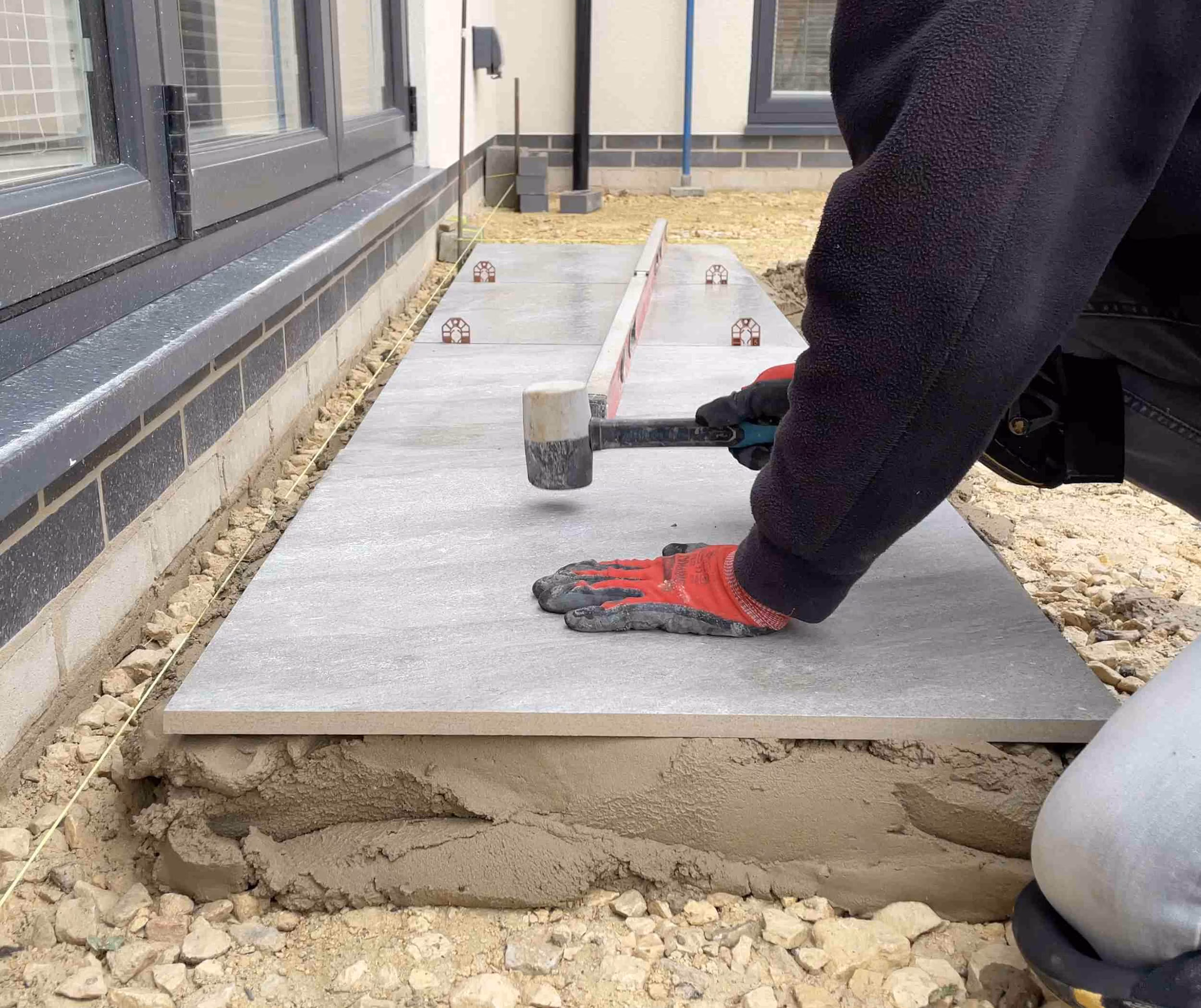 Can porcelain paving be laid on concrete?