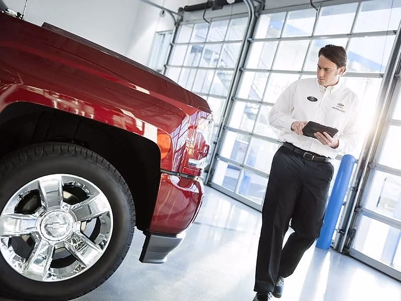 Will GM give a new car a free service trip?