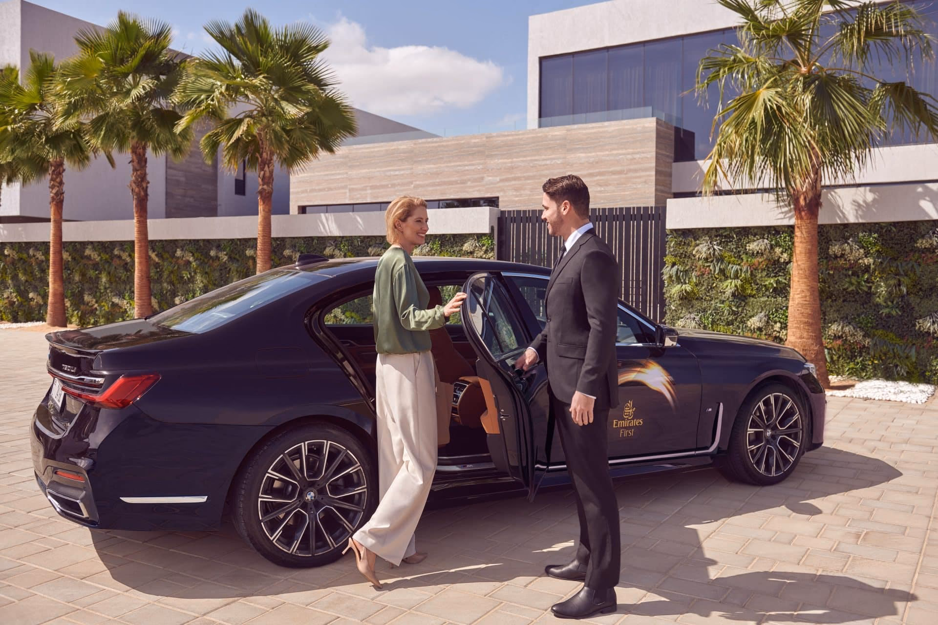 How do I book Emirates business class chauffeur service?