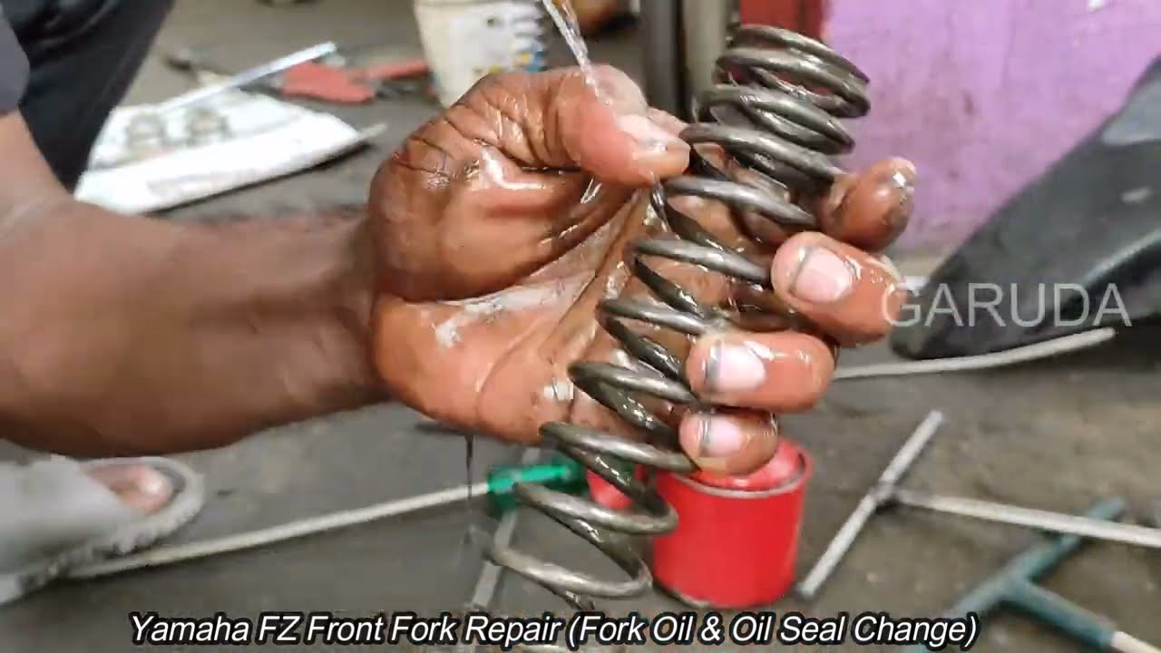 How do you remove oil from a fork?