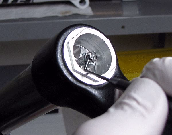 How do I adjust the travel of a 32mm float Fork?