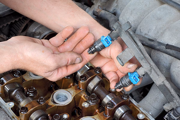 What should I do if my car has a fuel injector problem?