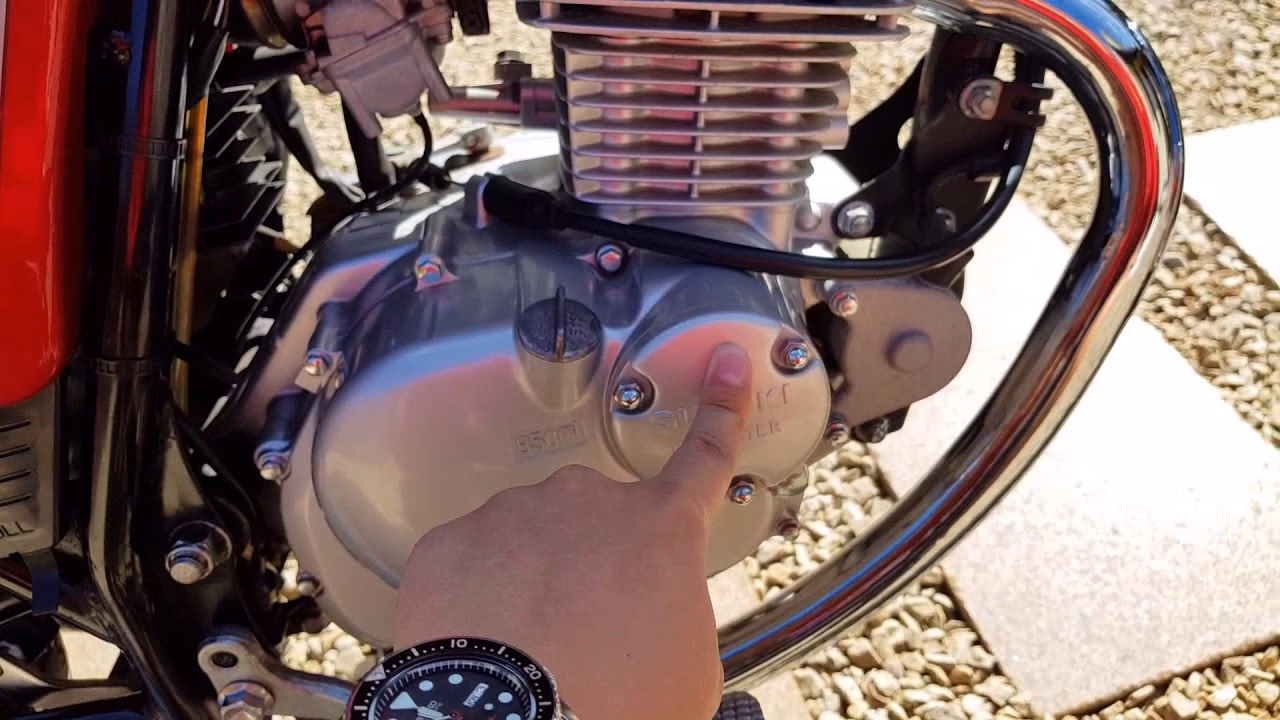 How do you change engine oil on a motorcycle?