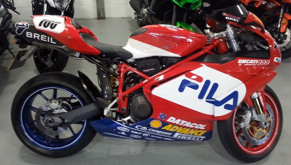 What is a professional MOT test for a motorcycle or scooter?