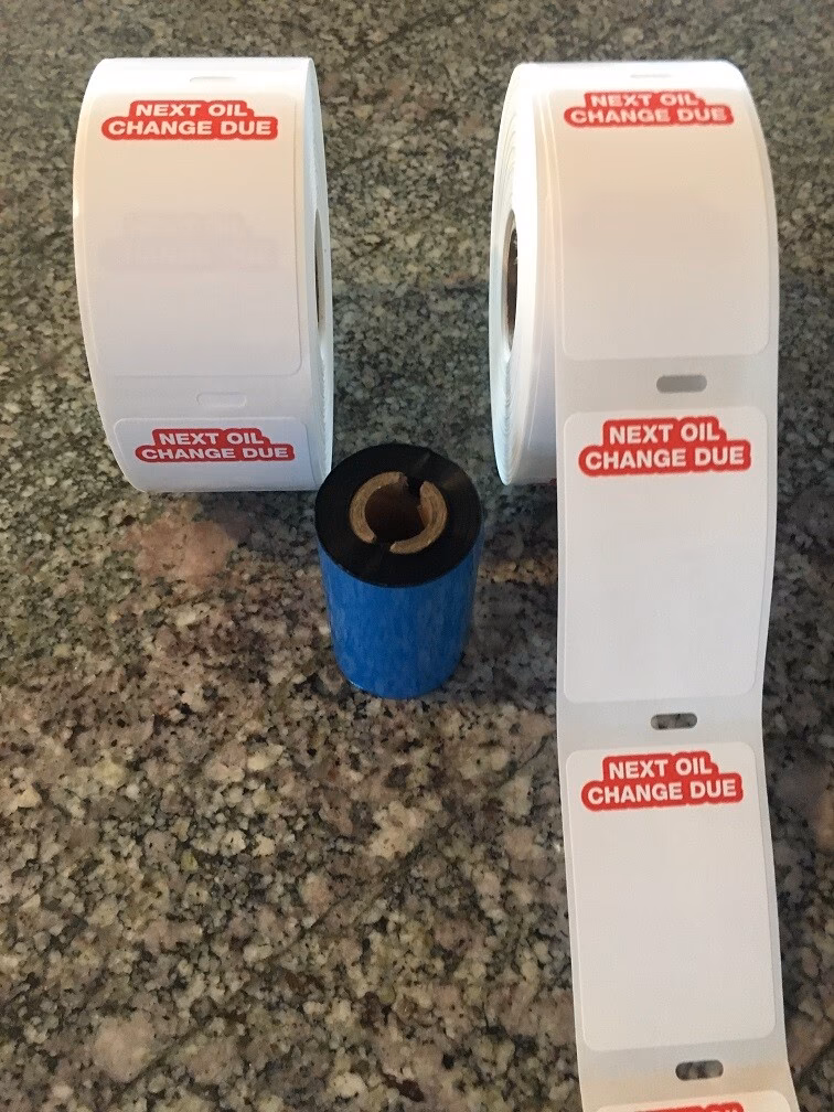 What is included in the oil change service reminder printer kit?