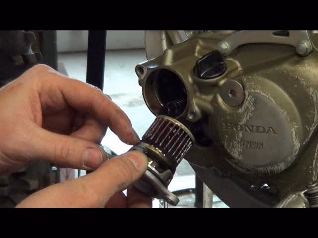 How often should I change the oil on a Honda CRF450R?