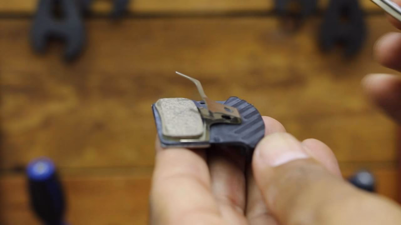 How do you push back a brake pad?