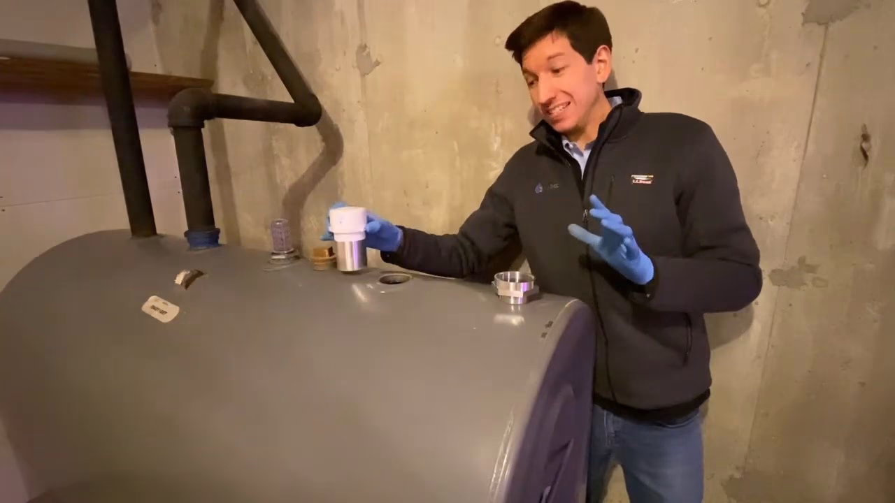 How do I install the oil tank gauge Assembly?