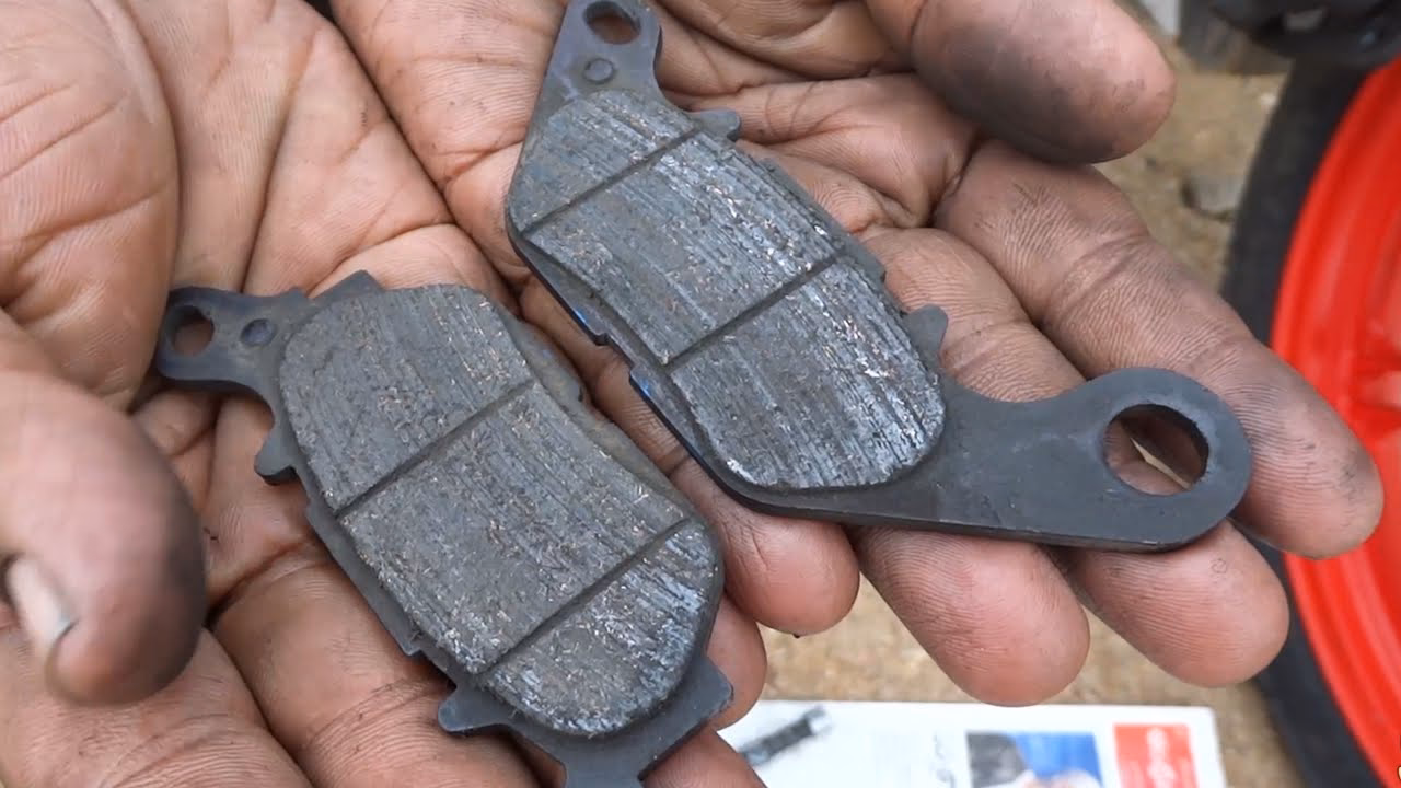 How do motorcycle brake pads work?