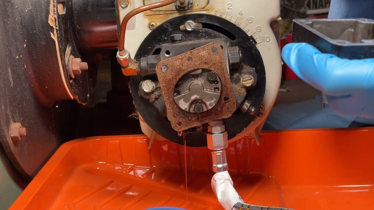 How do you clean an oil filter on an oil furnace?