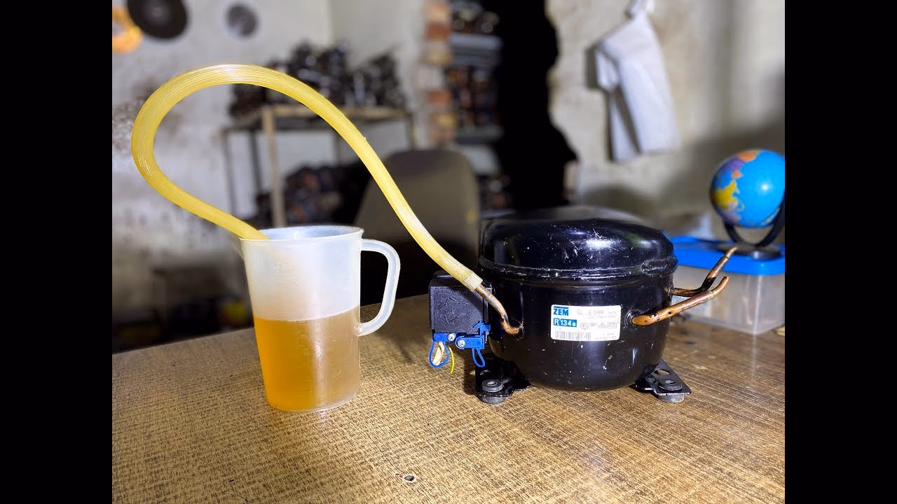 How can you remove oil from a compressor?