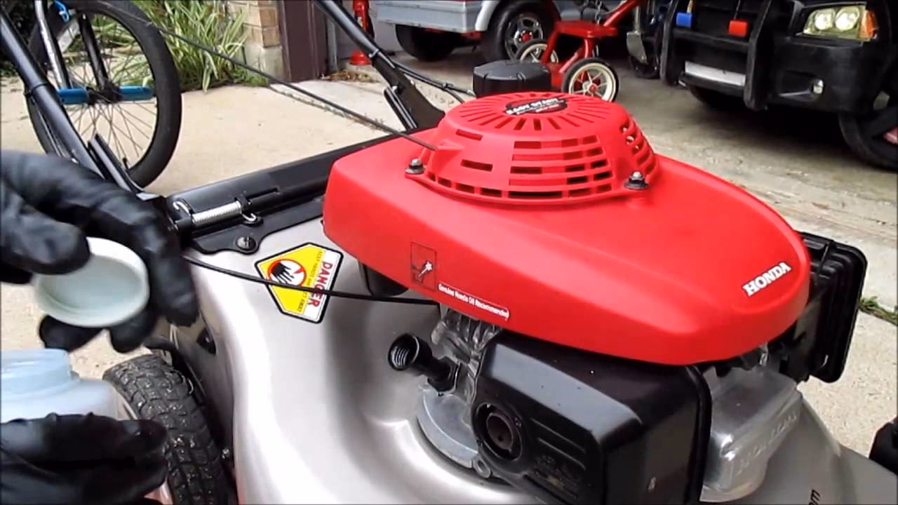 How to clean up after changing the oil on a Honda Lawnmower?