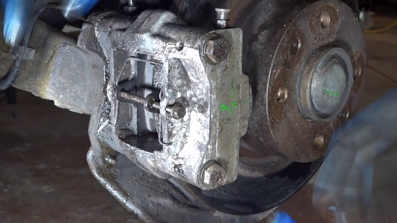 How do you remove brake pads from a car?