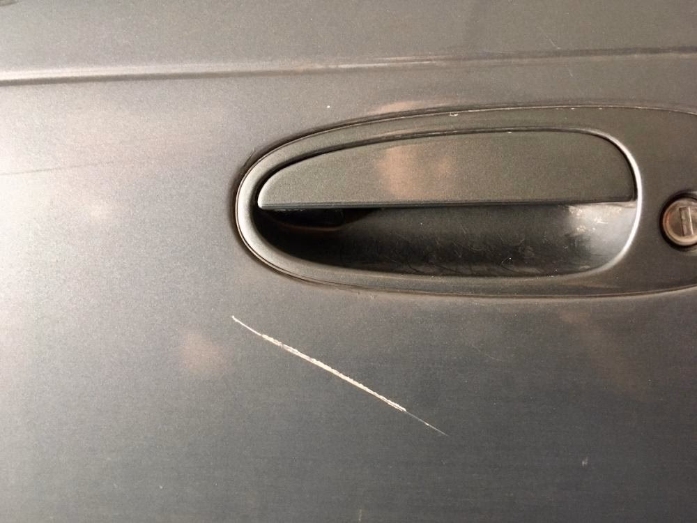 Can you fix a deep scratch on a car door?