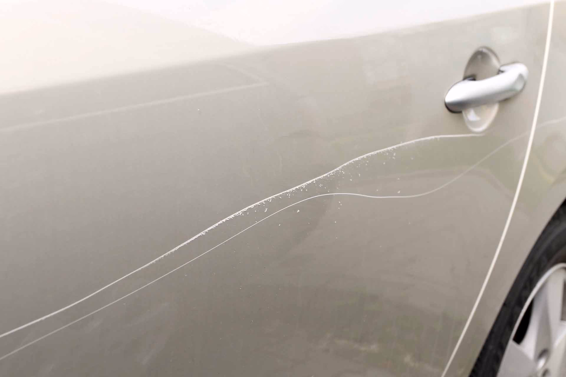 What happens if you scratch a car door?