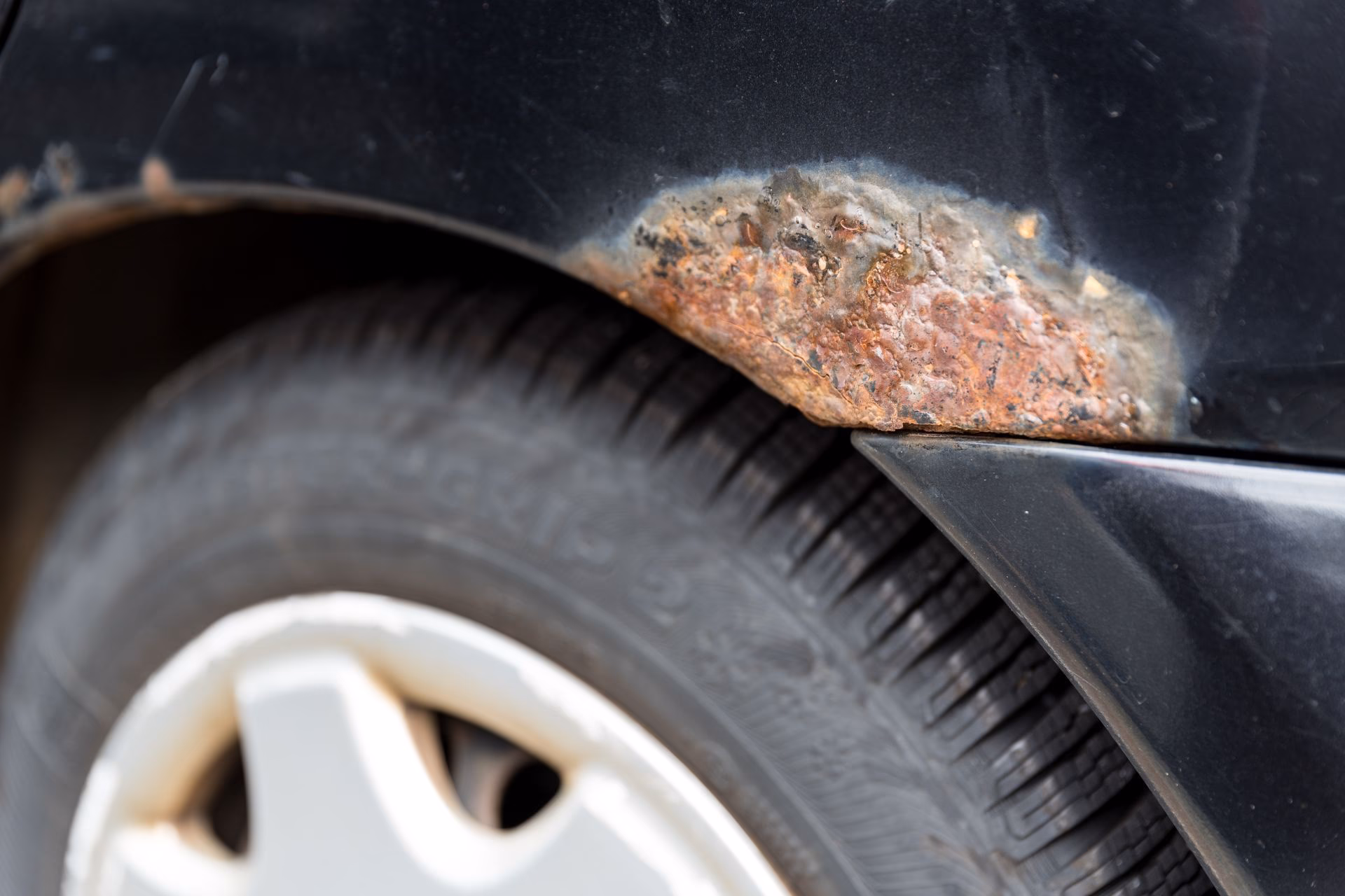 How do I stop rust from spreading on my car?