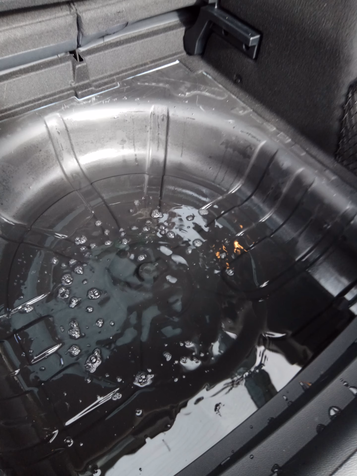 How do you get water out of a car boot?