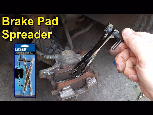 How does a laser disc brake pad spreader work?