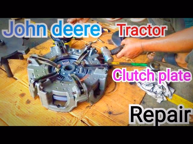 How do you clean a powershaft clutch on a tractor?