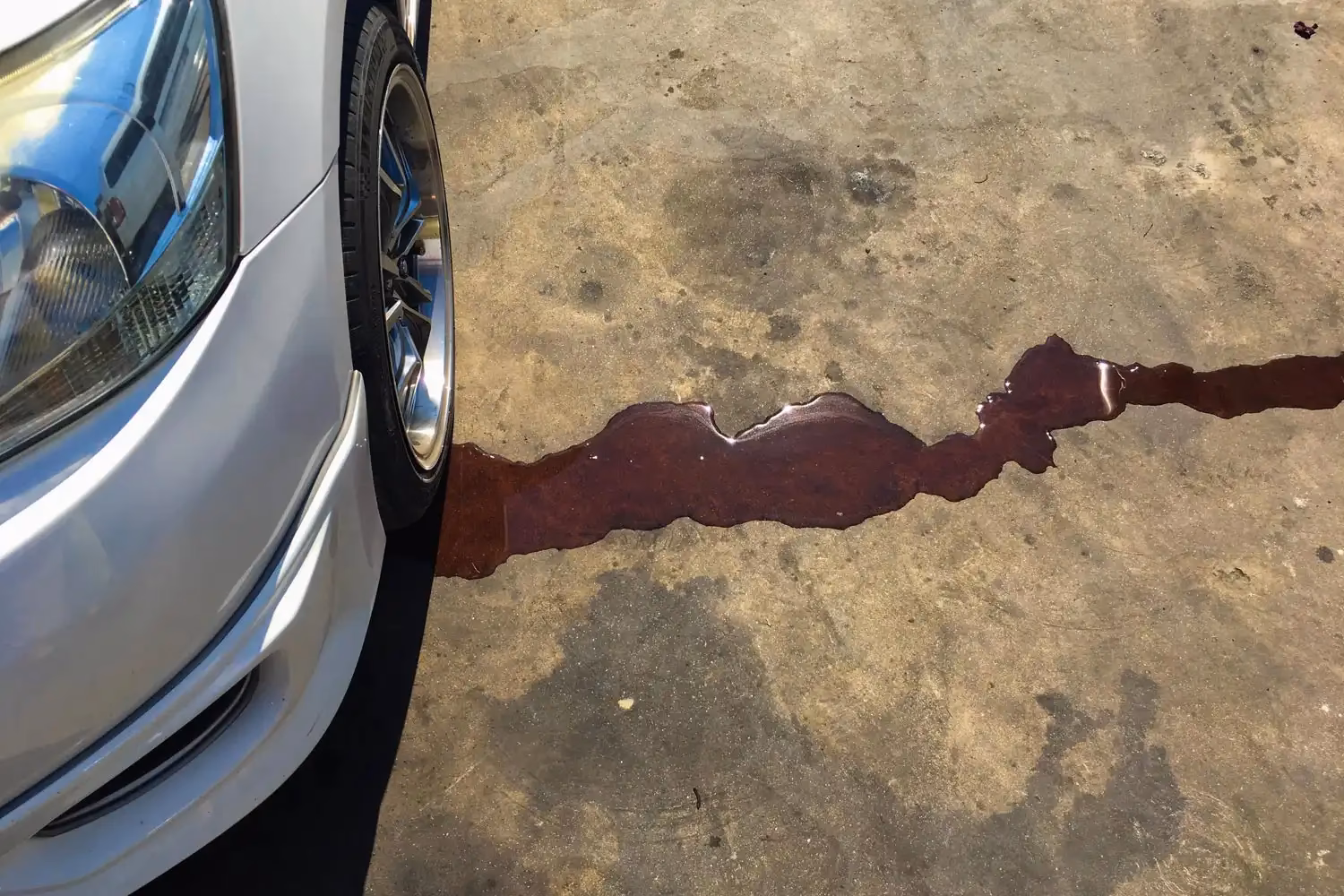 What causes oil dripping on the floor?