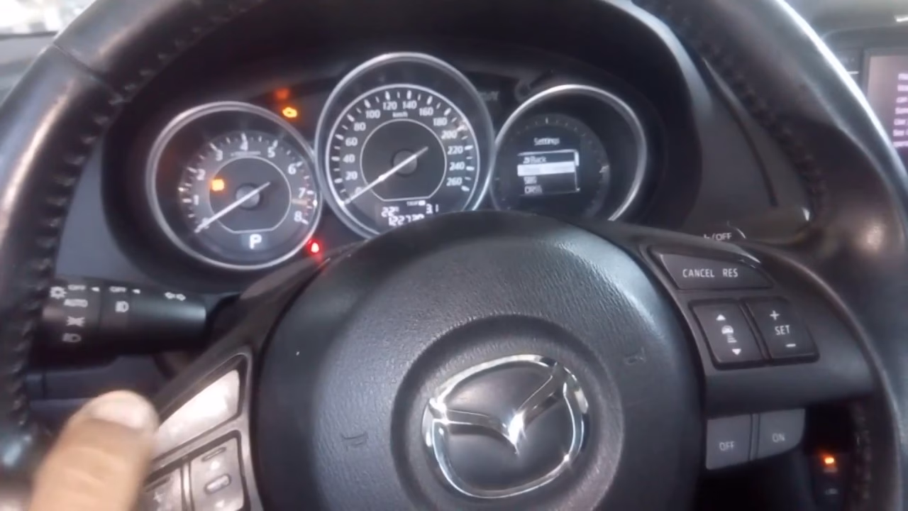 How do I know if my Mazda 6 oil is low?