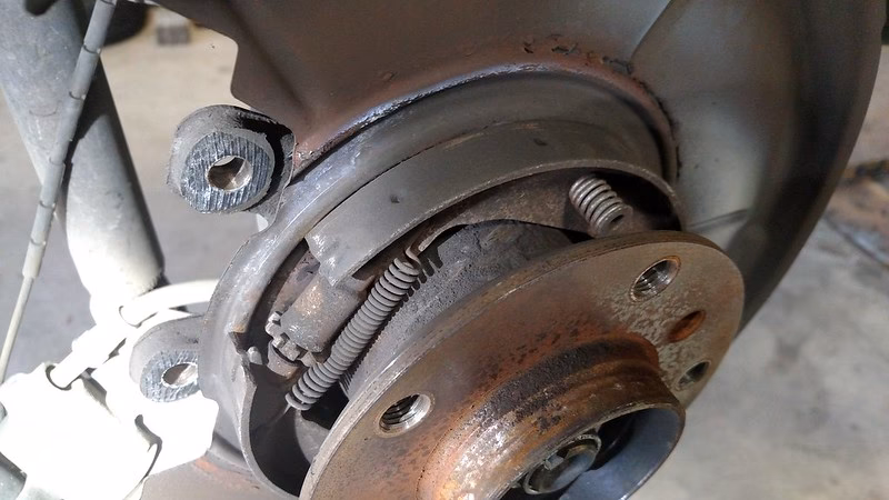 How has BMW's parking brake system evolved?